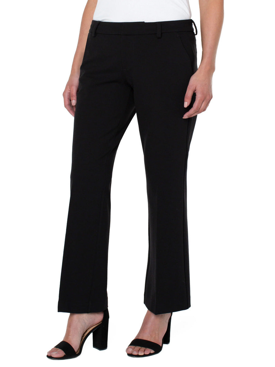 Liverpool Kelsey 31” Flare Pant in black styled with heeled sandals, showcasing a tailored fit by Liverpool.
