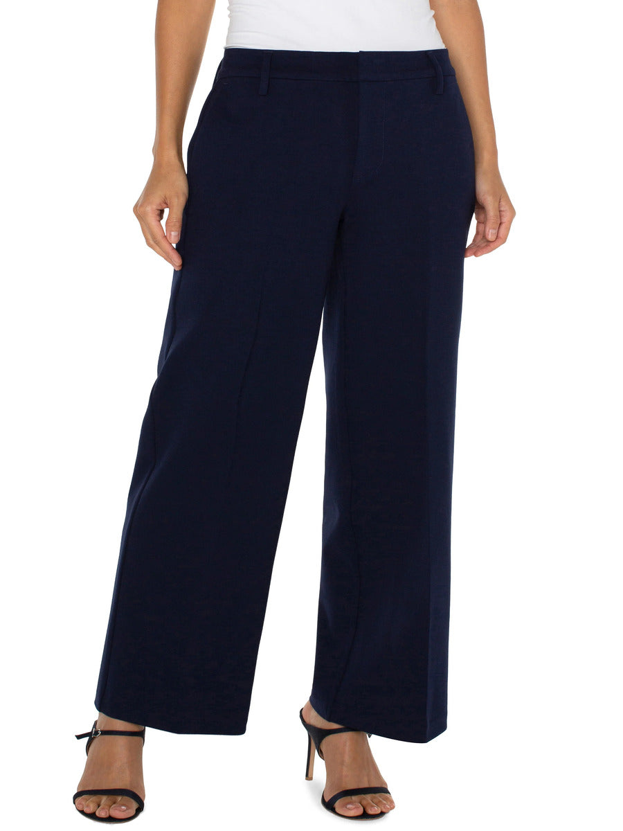 Liverpool Kelsey 31” Wide Leg Trouser in navy blue styled with black open-toe heels, from Liverpool brand.