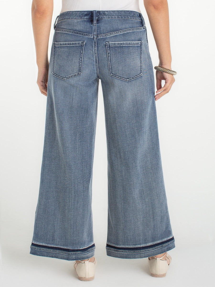 Rear view of Liverpool Super Stride Wide Leg Jeans in medium denim with wide leg silhouette and striped hem detail