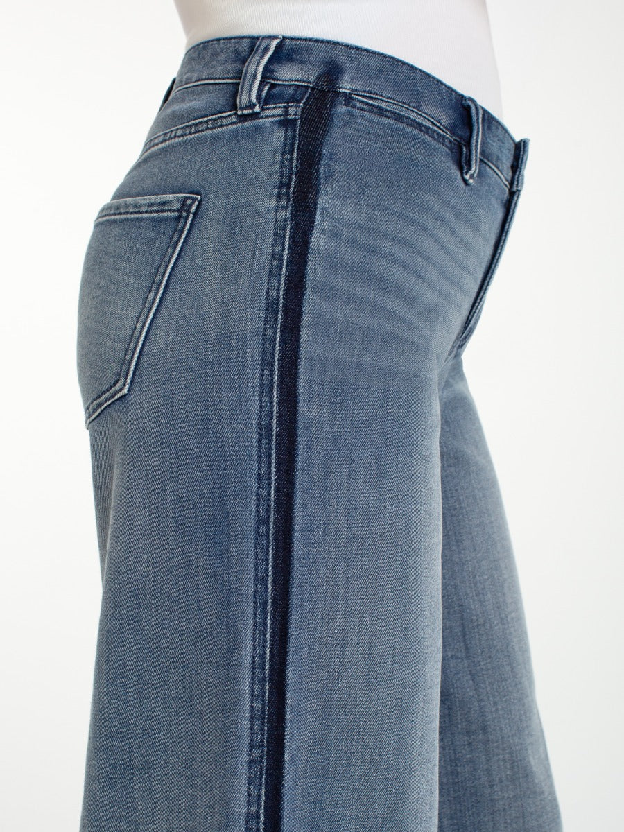 Close-up of denim Liverpool Super Stride Wide Leg Jeans with side seam detail by Liverpool on white background