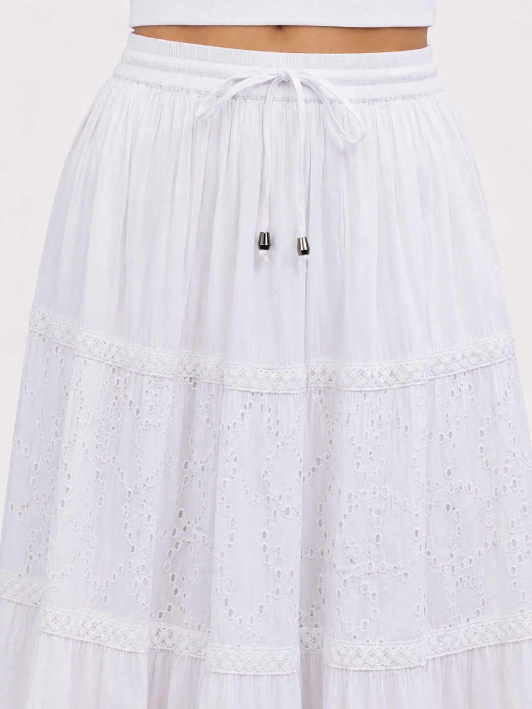 Prairie Eyelet Tiered Midi Skirt by Nulook Fashions in white with eyelet detailing and tiered design.