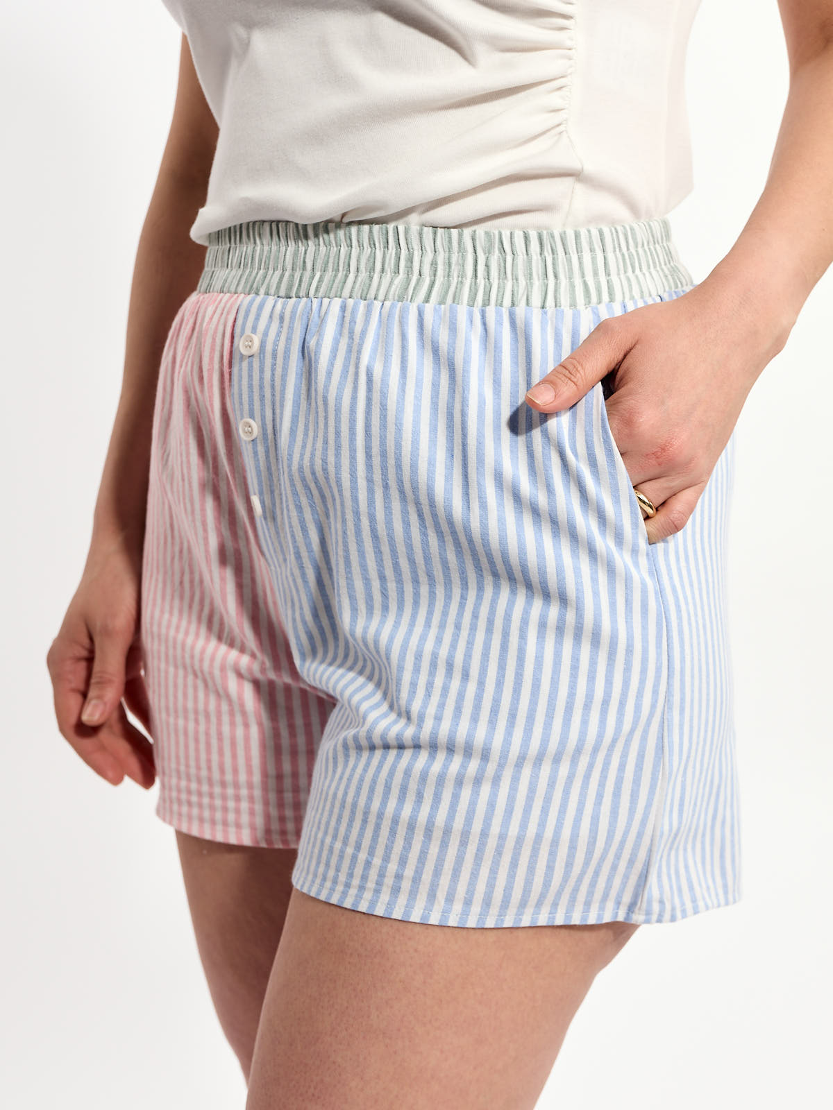 Very J Colour Block Stripe Casual Shorts with pink and blue vertical stripes, elastic waistband, and side pockets by Very J.