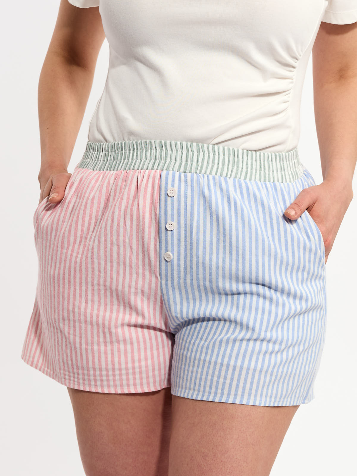 Very J Colour Block Stripe Casual Shorts in pink and blue stripes with button details and a green waistband by Very J