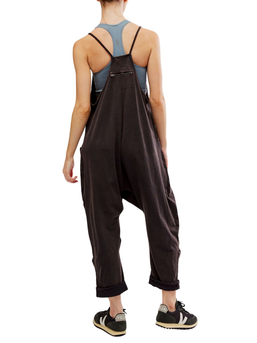 Back view of a black Free People Hot Shot Onesie paired with sneakers and a gray racerback top by Free People