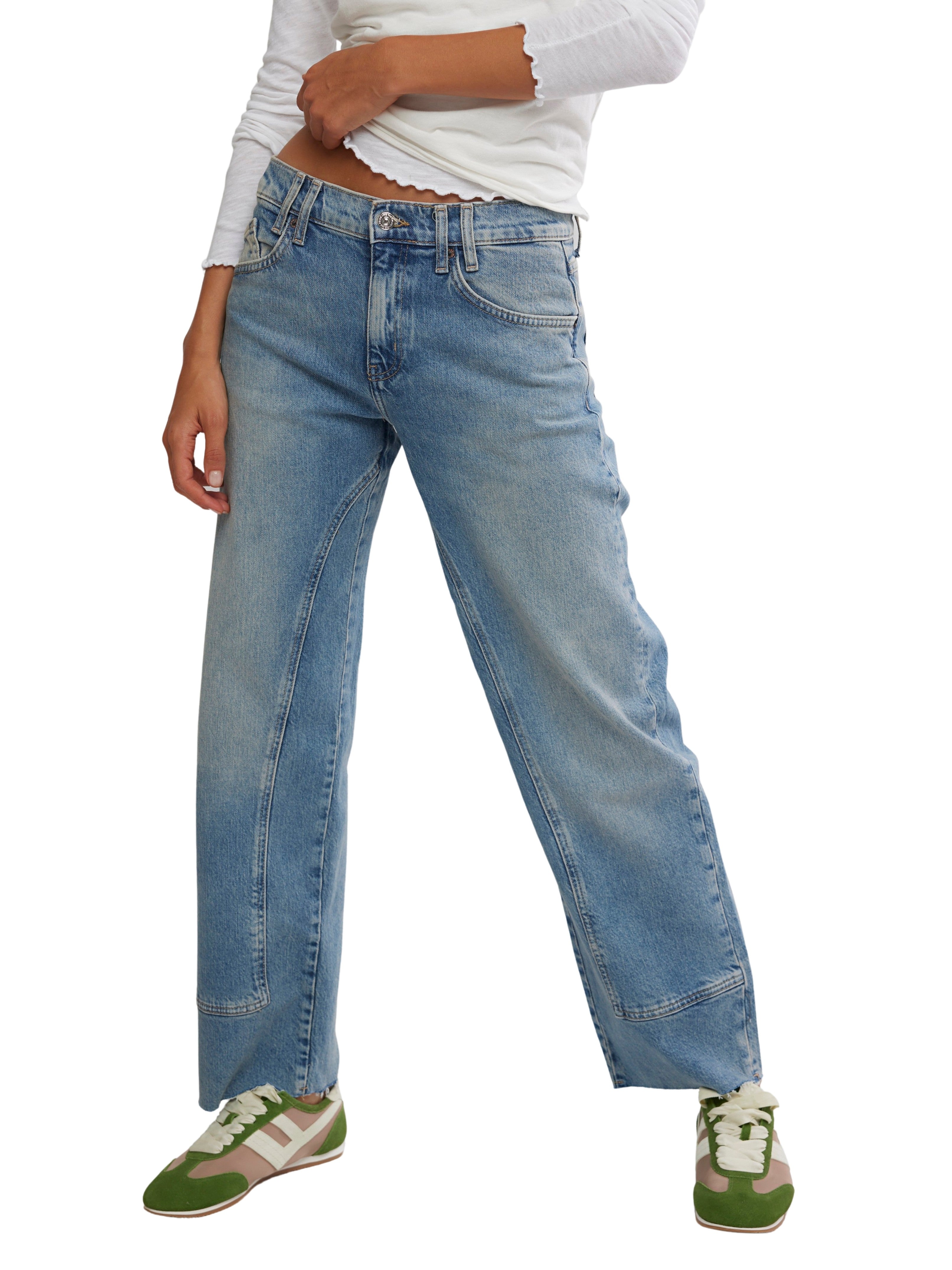 Free People Risk Taker Mid Rise Straight Leg Jeans 29.5 Inch in light blue denim paired with green and white sneakers