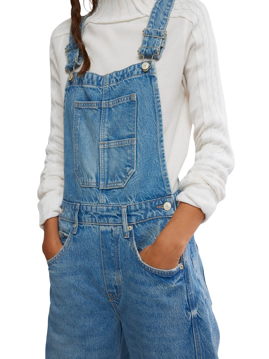 Free People Good Luck Denim Overalls in light blue denim styled with a white knit sweater top by Free People