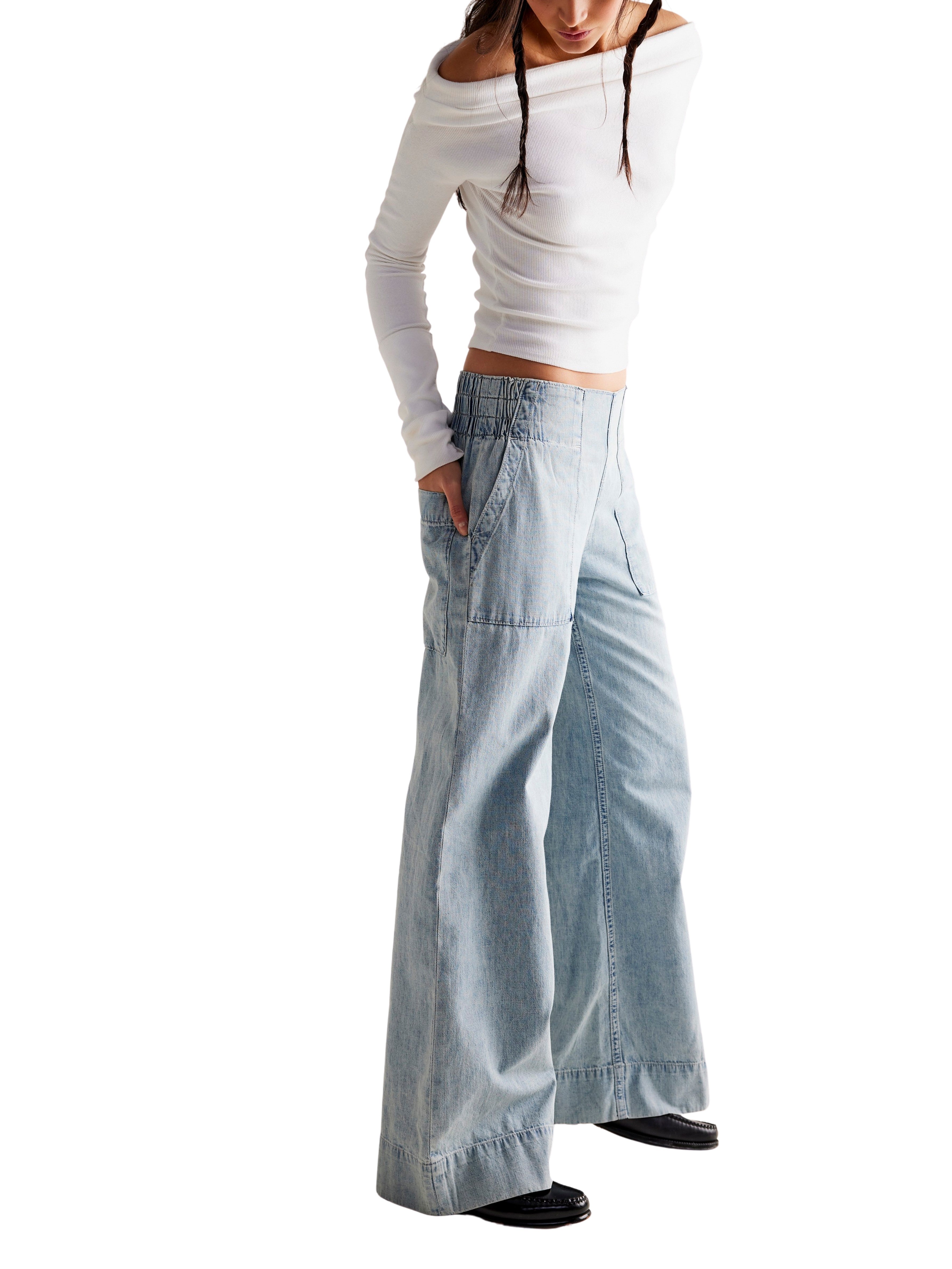 Light wash wide-leg Free People Breezy Elastic Waist Pull-On Denim with front pockets and elastic waistband by Free People.