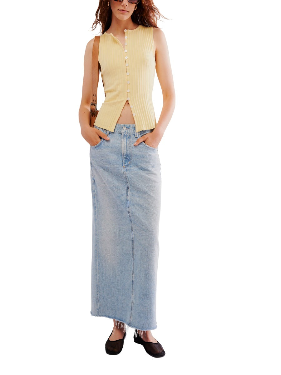 Free People Tilly Button Front Vest in yellow ribbed knit paired with a light blue denim maxi skirt from Free People.
