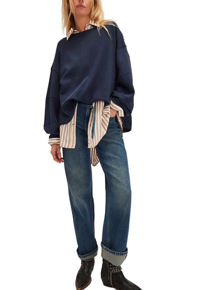 Navy long sleeve crew top layered over striped shirt with denim jeans styled by Free People Total Eclipse Long Sleeve Crew Top
