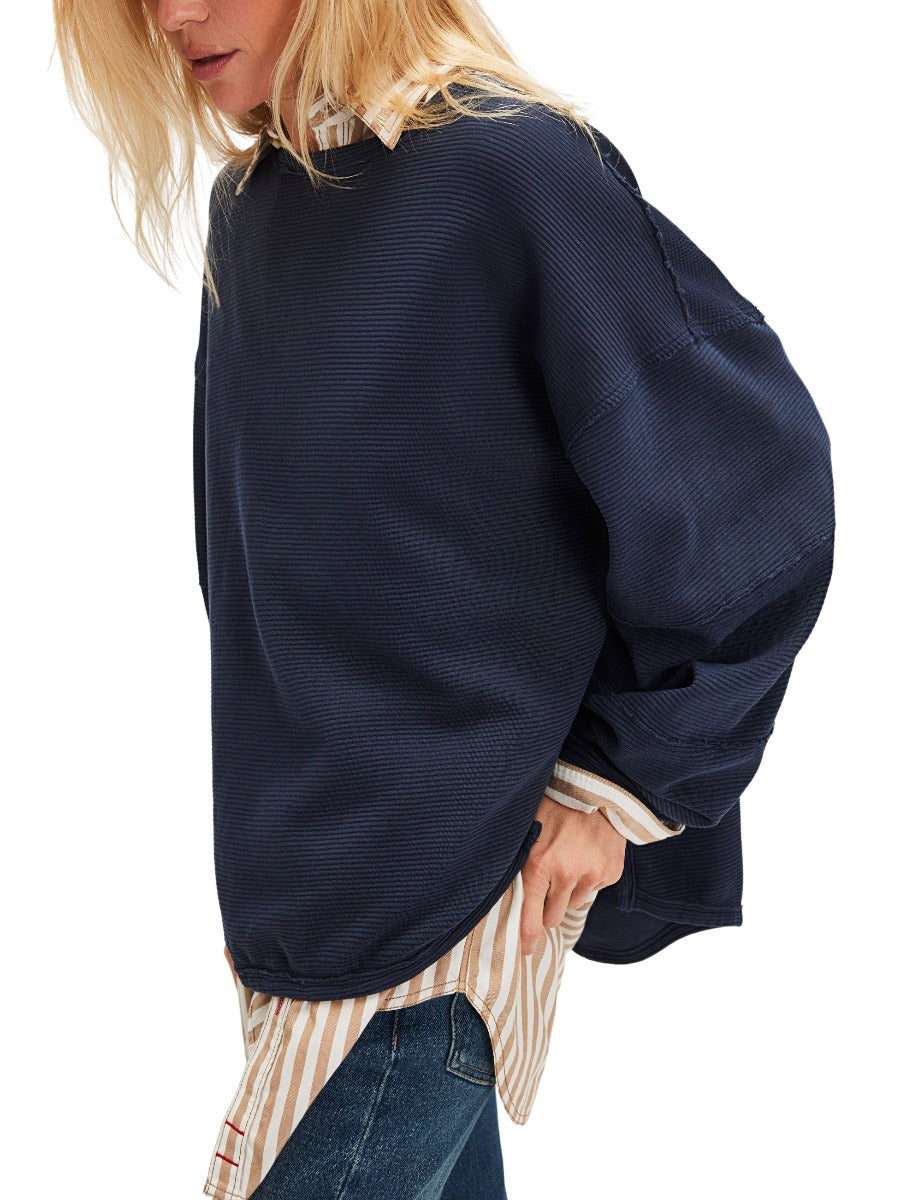 Loose fit navy knit sweater layered over striped shirt featuring Free People Total Eclipse Long Sleeve Crew Top by Free People