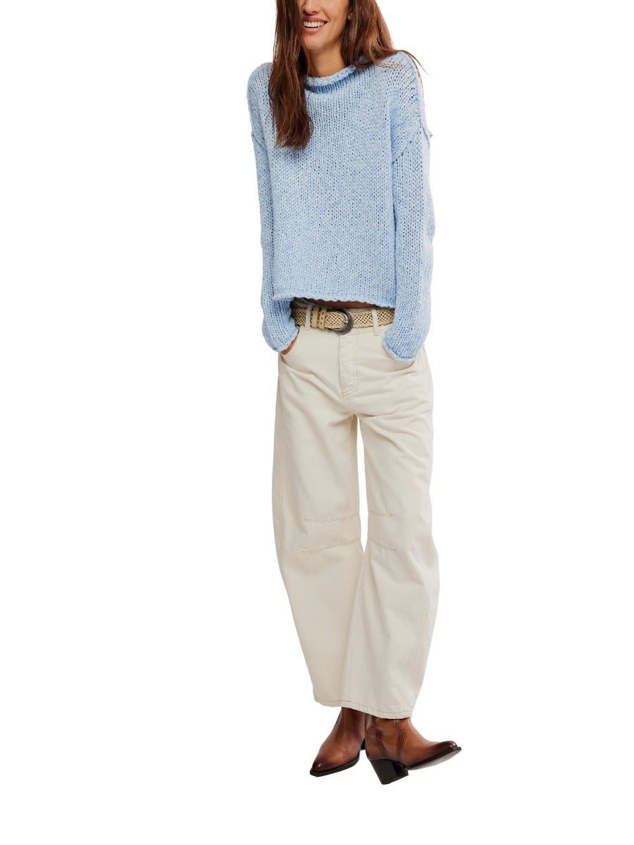 Free People Opal Reverse Seam Crewneck in light blue knit sweater paired with cream wide-leg pants and brown boots