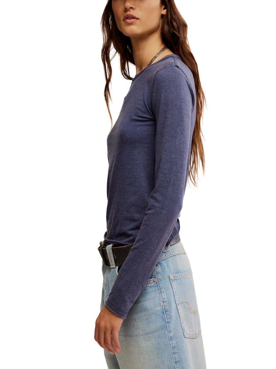 Free People Nova Long Sleeve Tee in navy cotton blend paired with light wash denim by Free People.