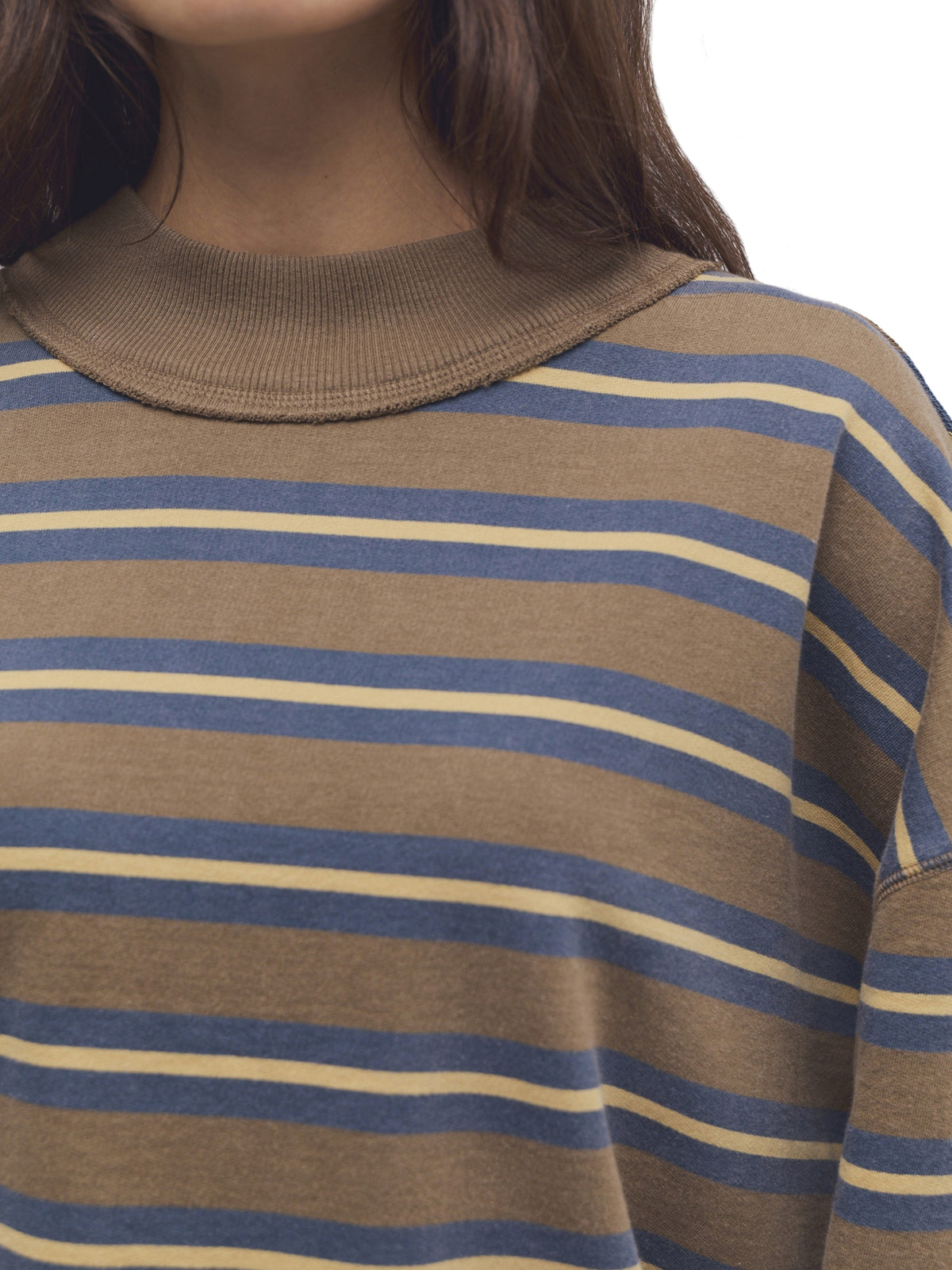 Brown striped knit top with blue and cream horizontal stripes and a ribbed neckline