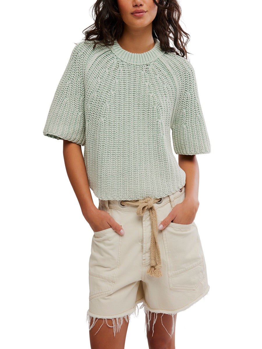 Free People Amy Washed Half Sleeve Crew Sweater in soft green knit styled with casual beige shorts by Free People