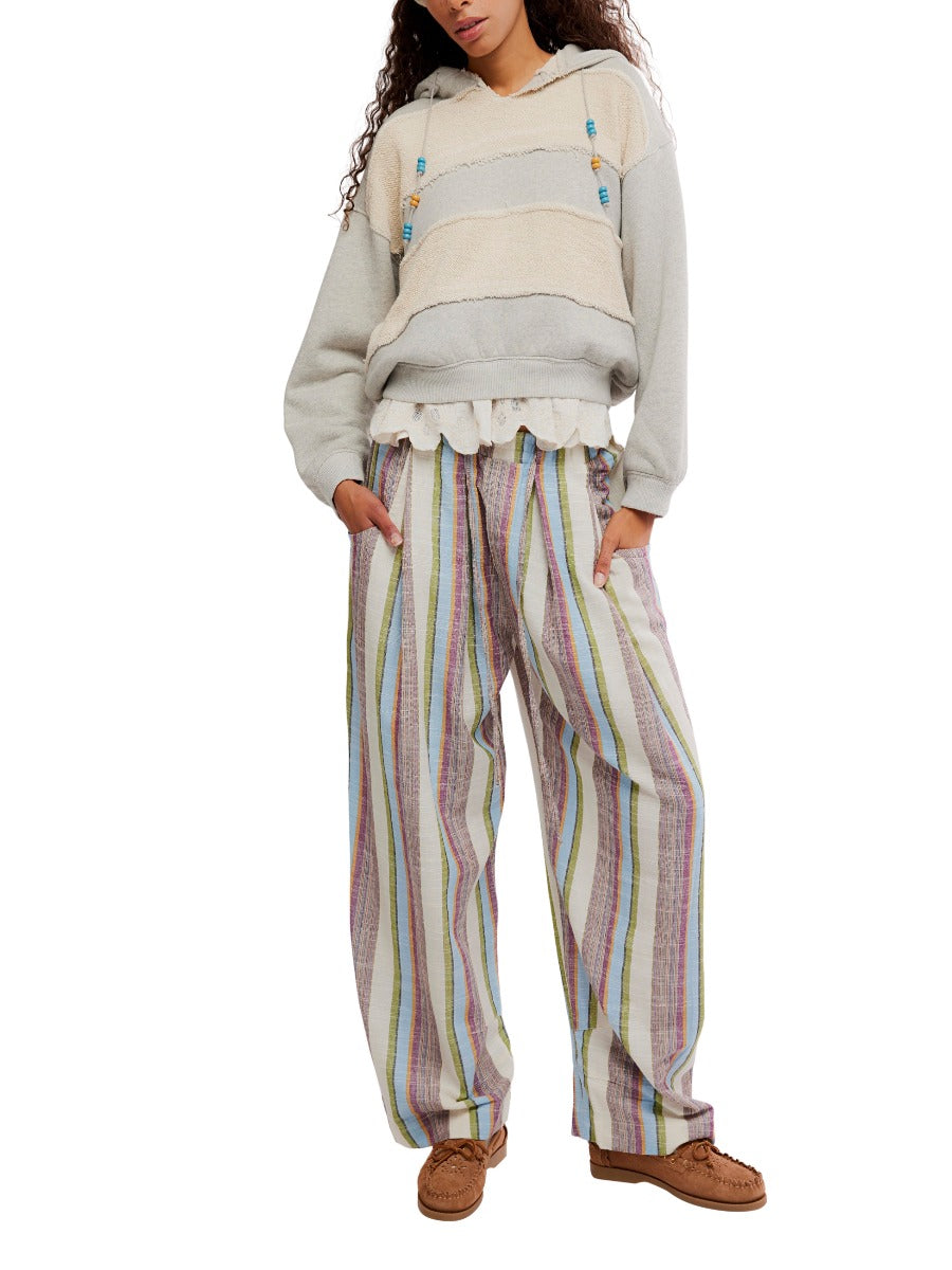 Loose fit multicolor striped trousers styled with a neutral hoodie and moccasin shoes, Free People Chambers Laid-Back Stripe Pant.