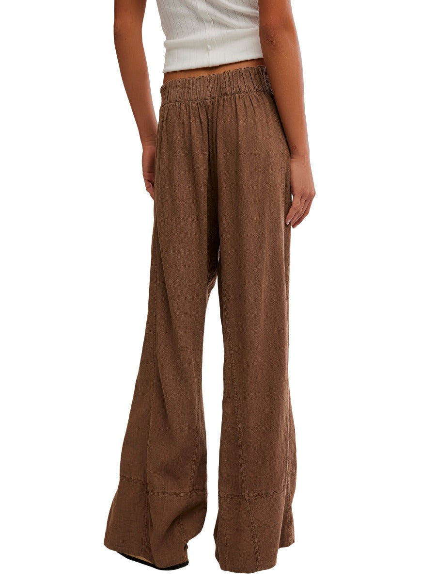 Back view of brown Free People Days End Linen Pocket Pull-On Pant made of linen with elastic waistband and wide legs