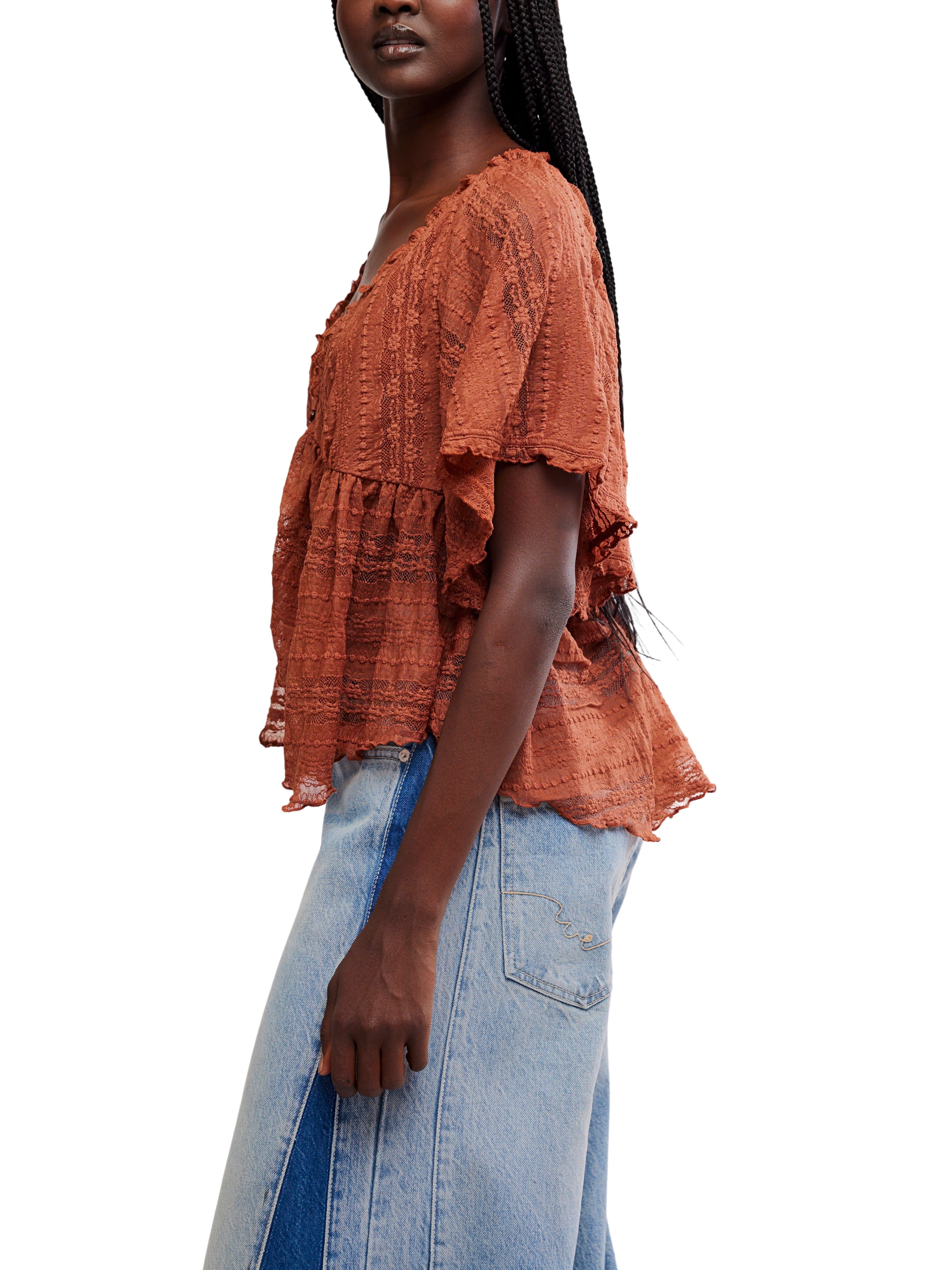 Rust-colored textured short-sleeve blouse paired with light blue denim skirt featuring contrast paneling.