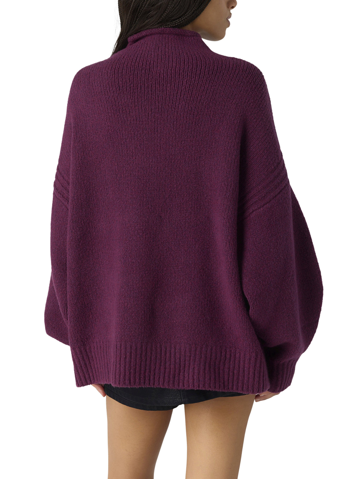 Back view of a burgundy oversized turtleneck sweater with dropped shoulders and ribbed trim