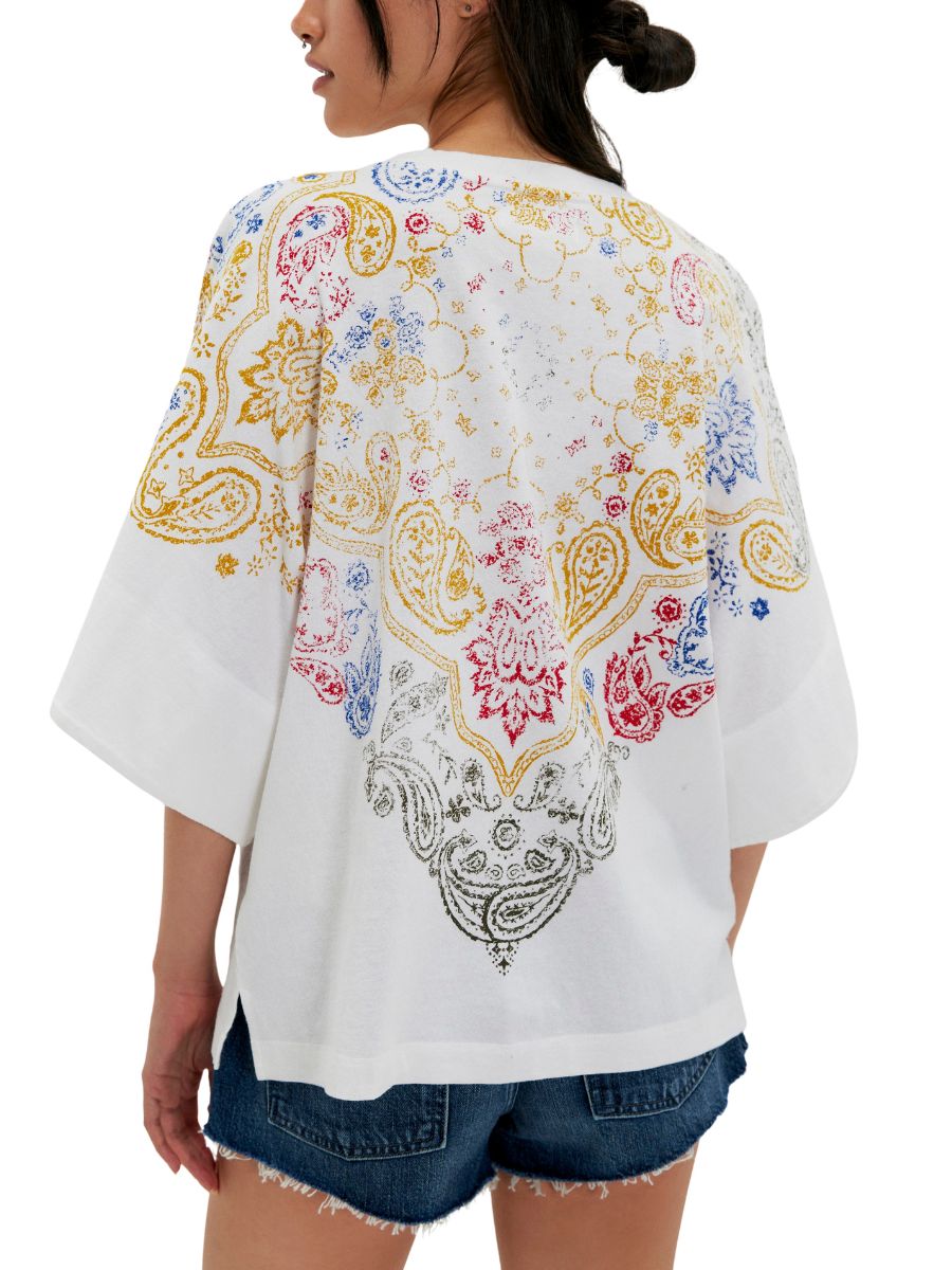 Free People Heirloom 1/2 Sleeve Tee in ivory with colorful paisley print, styled with denim shorts by Free People.