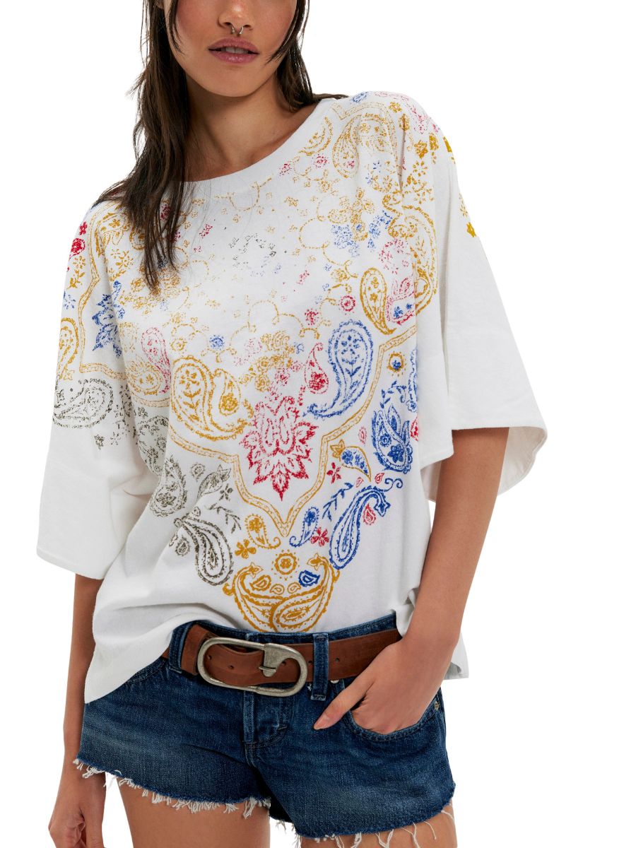 Free People Heirloom 1/2 Sleeve Tee in ivory with colorful paisley print from Free People, styled with denim shorts.