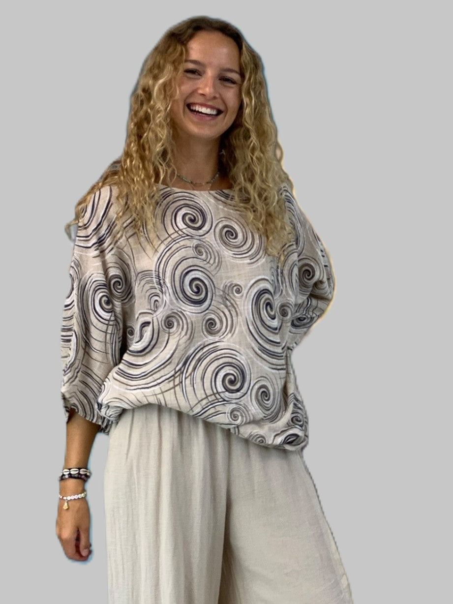 Swirl Cotton 3/4 Sleeve Oversized Casual Top by Plum Loco, beige with black swirl pattern, paired with light pants.