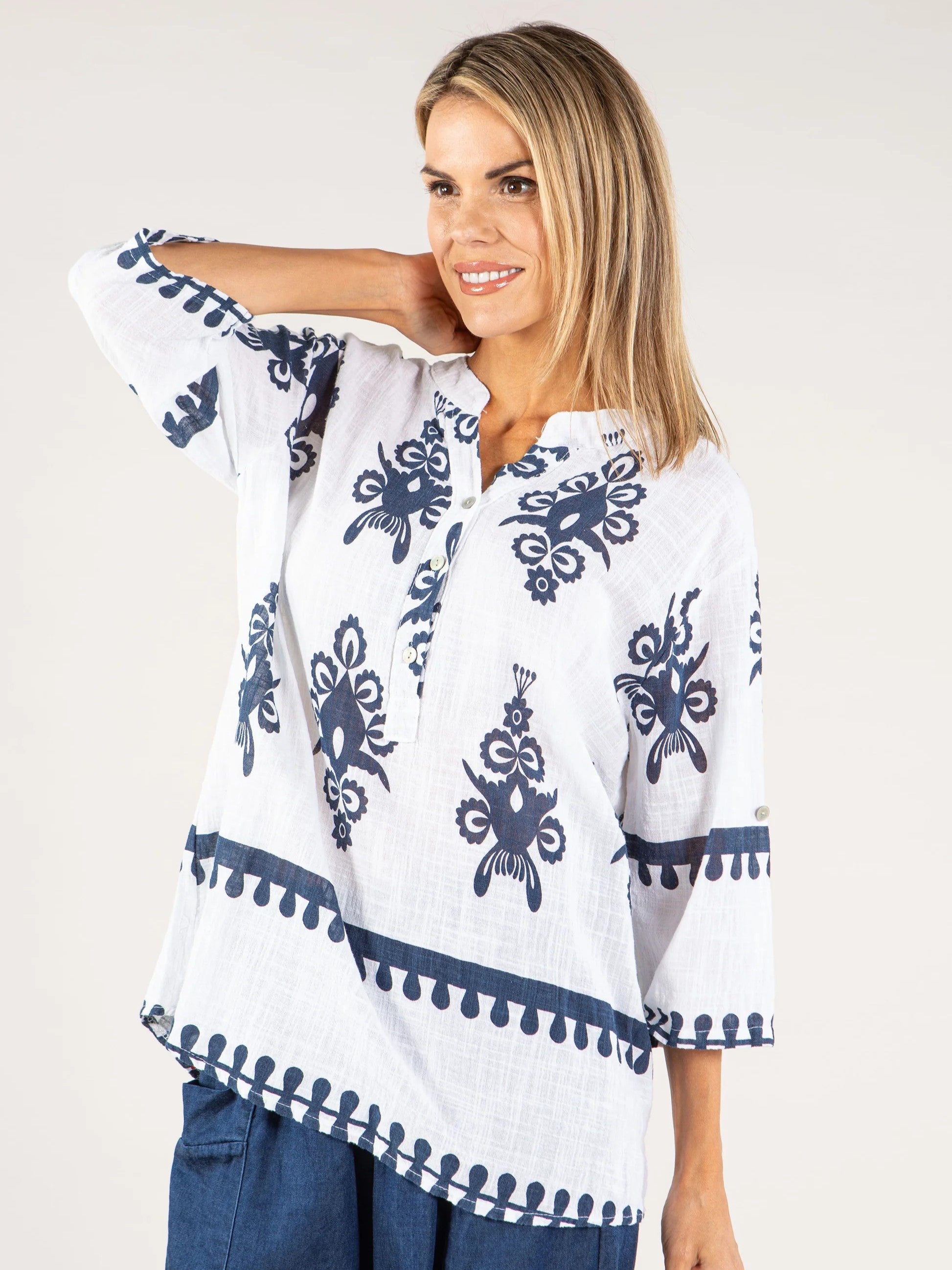 Papillon Vacation Border Hem Johnny Collar Top in white with blue floral print and 3/4 sleeves, styled casually