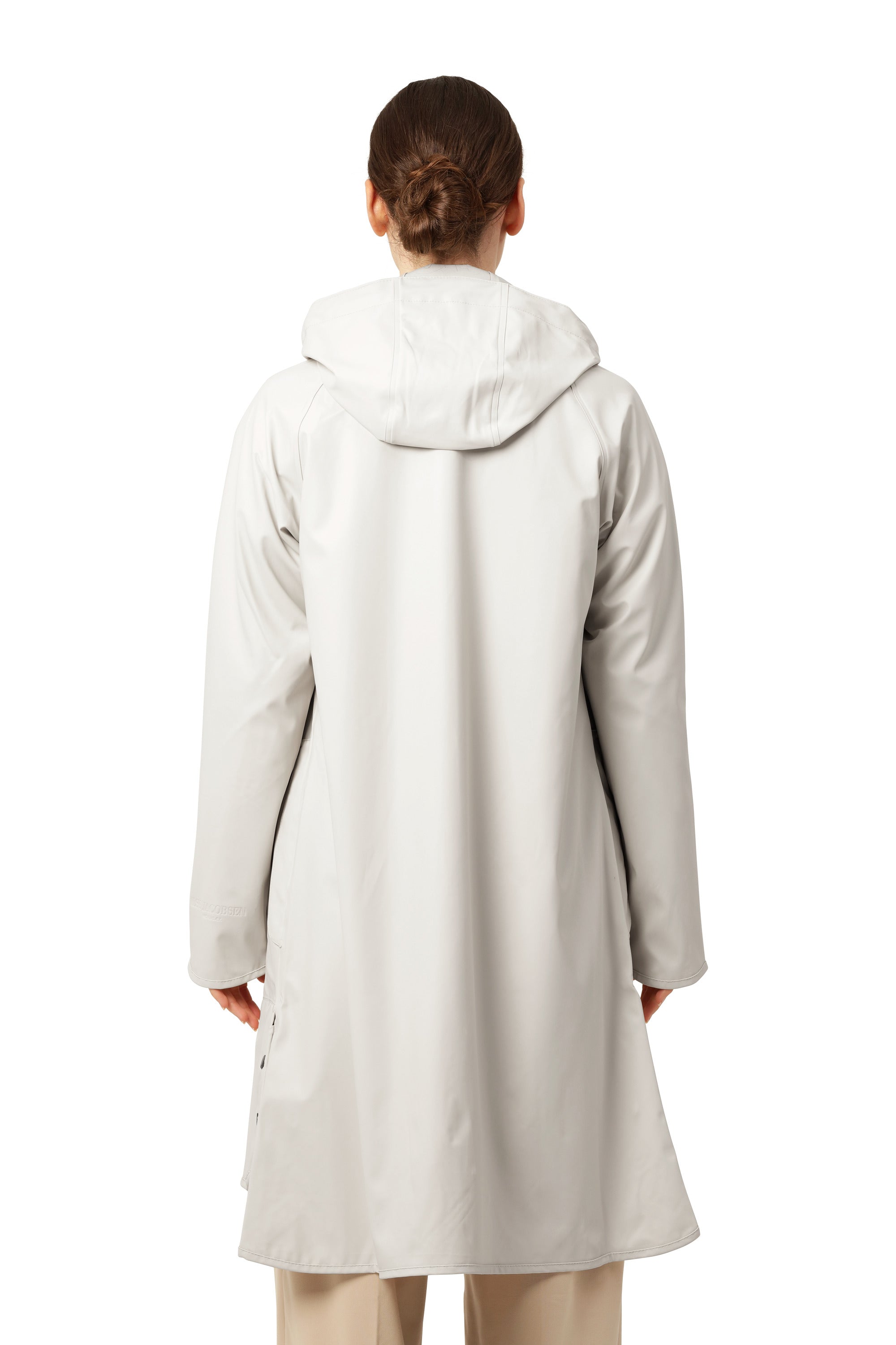 Back view of Ilse Jacobsen Waterproof Snap Hood Rain Jacket in cream color, lightweight outerwear by Ilse Jacobsen
