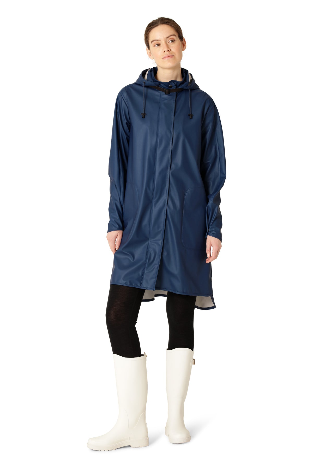 Ilse Jacobsen Waterproof Snap Hood Rain Jacket in navy blue worn with black leggings and white boots by Ilse Jacobsen