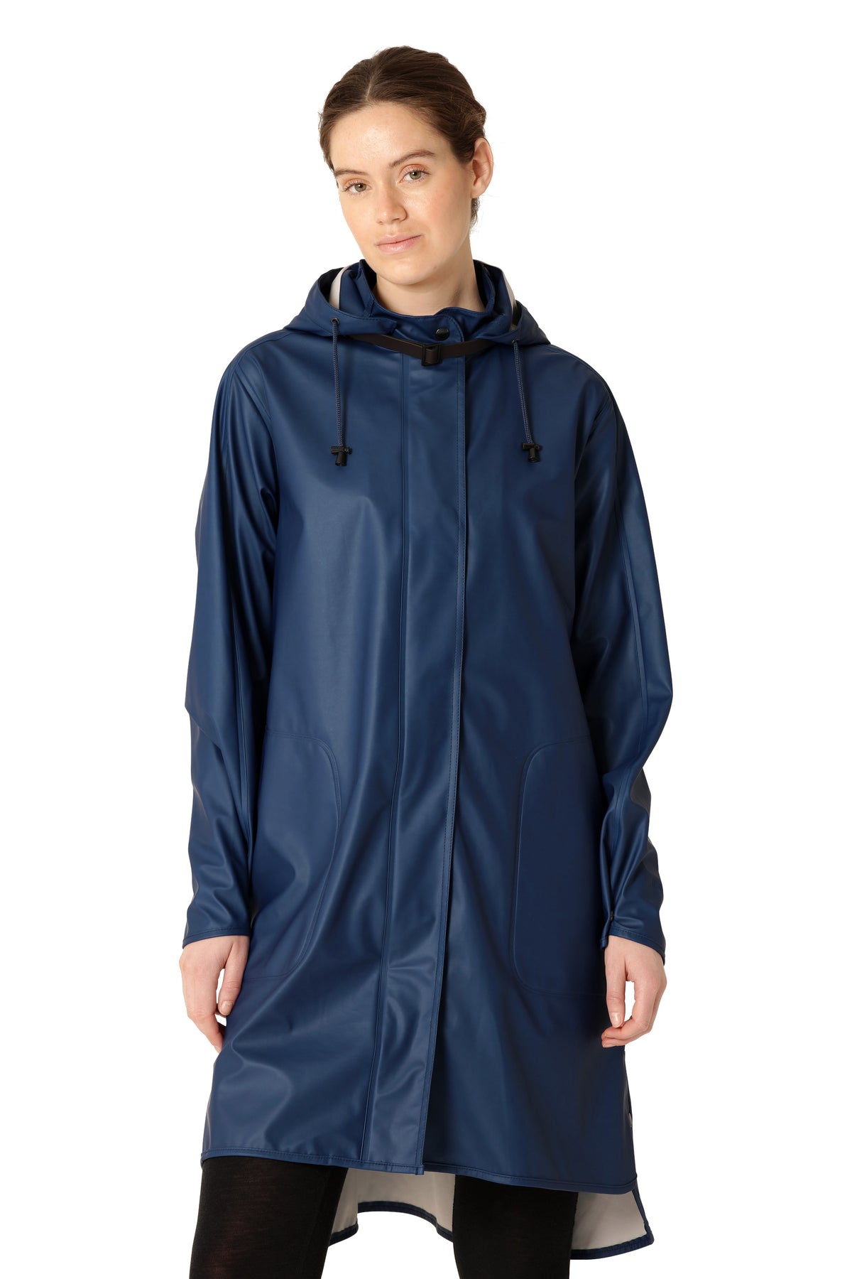 Model in a navy Ilse Jacobsen Waterproof Snap Hood Rain Jacket standing against a white background