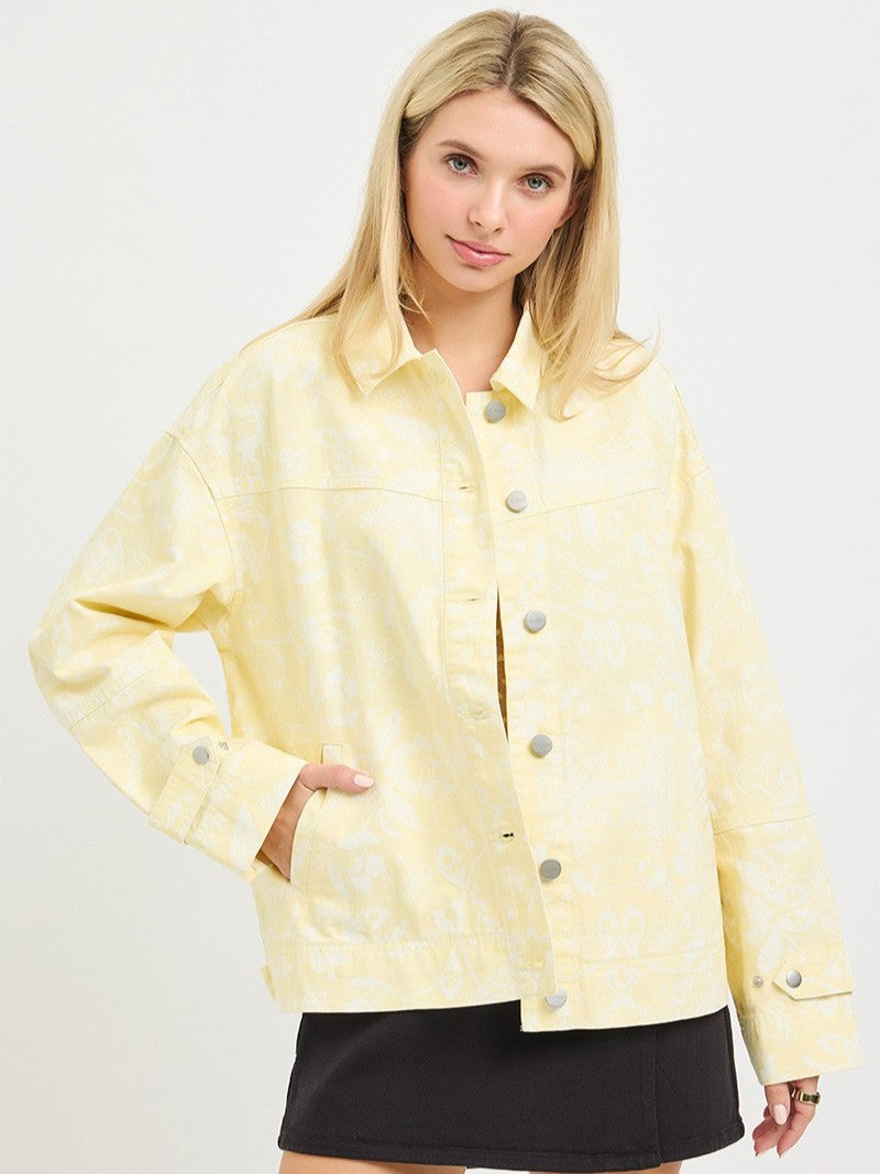 Light yellow Floral Print Denim Jacket by Risen with button front and subtle floral pattern detail.