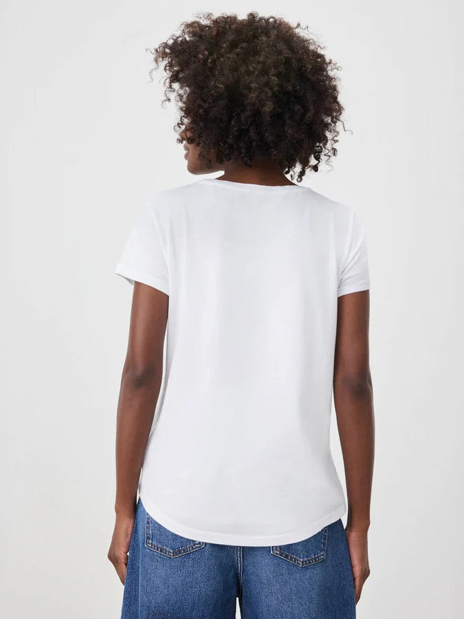 Back view of a plain white short-sleeve t-shirt paired with blue denim jeans on a neutral background.