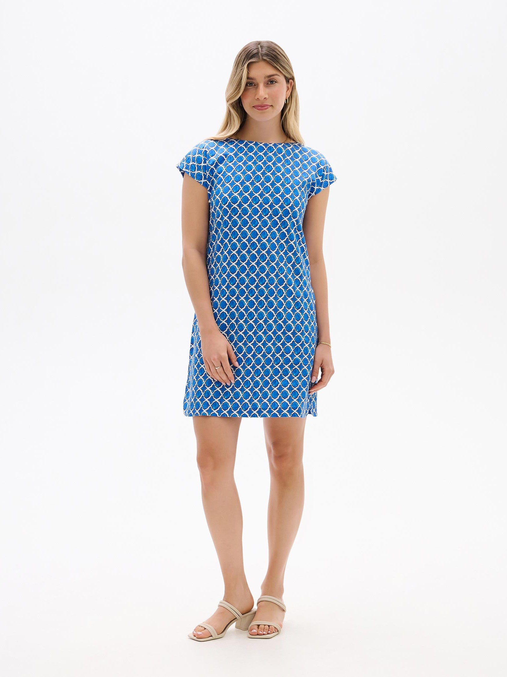 Hatley Capri French Dress by Hatley in blue with white chain link pattern and short sleeves worn with beige sandals