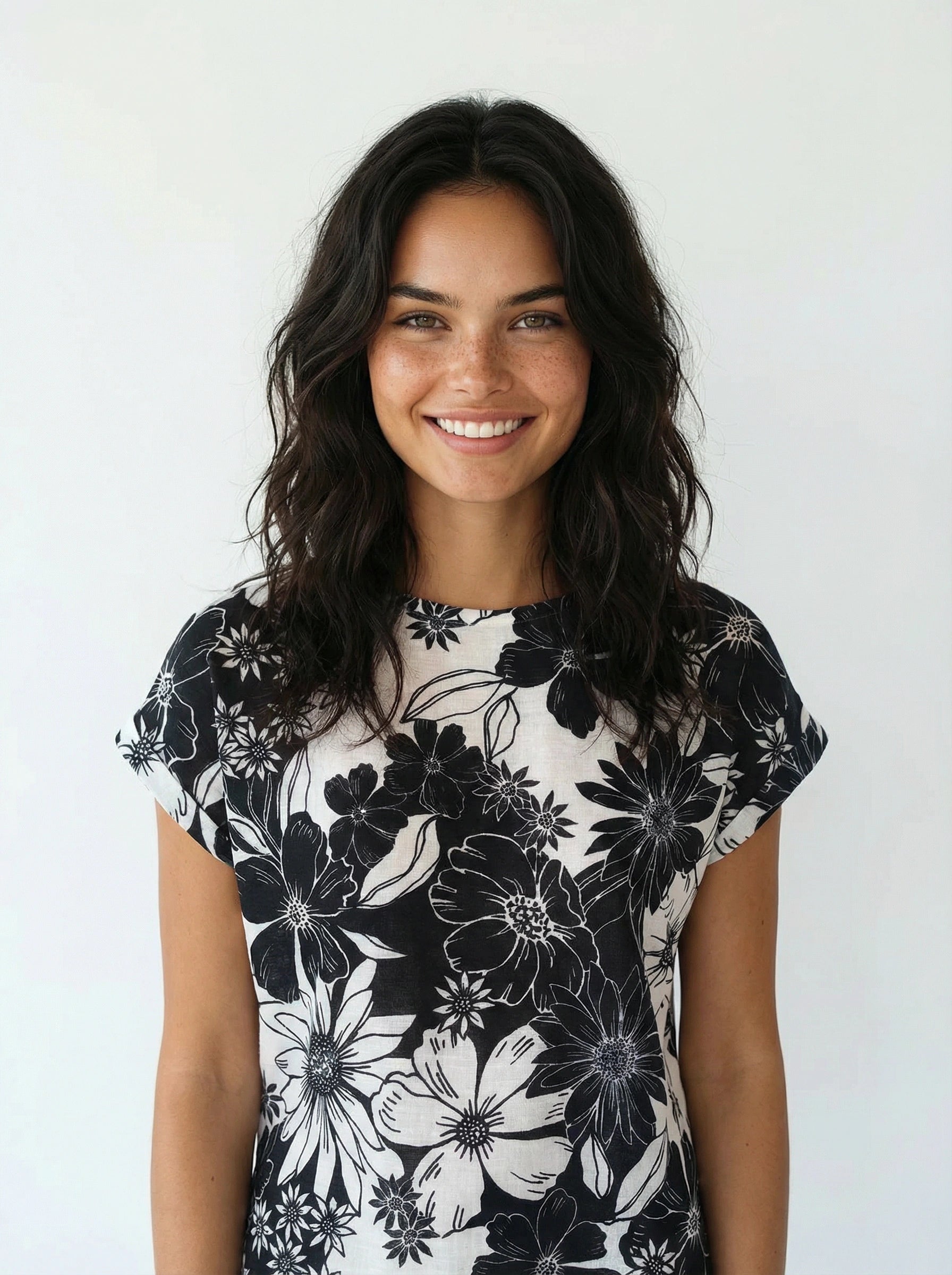 Creation Short Sleeve Printed Crew Neck Top by Creations featuring black and white floral print on soft fabric.