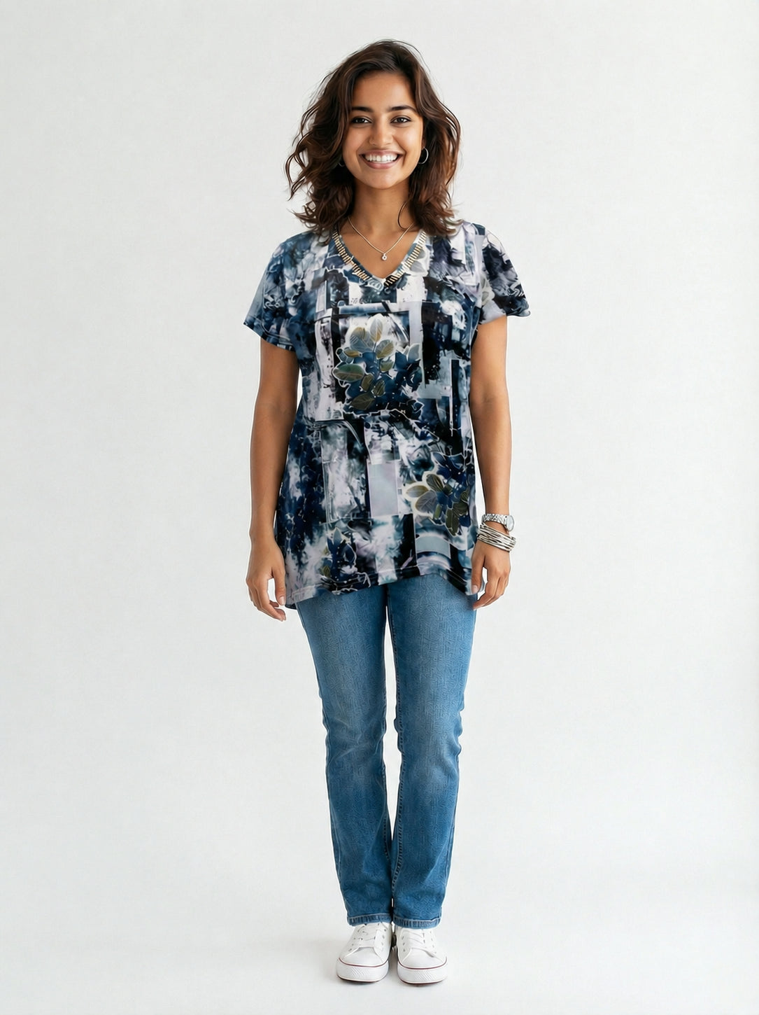 Creation Short Sleeve V-Neck Printed Top by Creations in navy blue with floral and abstract patterns, paired with jeans and accessories.