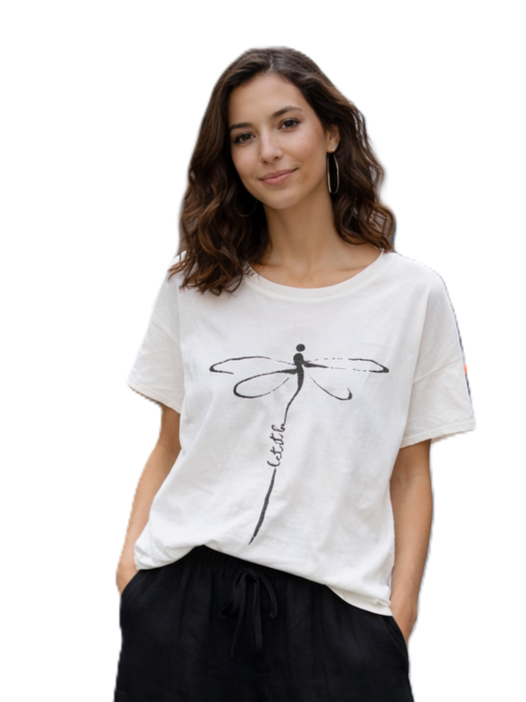 Model showcasing Dragonfly Print Linen Blend Short Sleeve Top by Plum Loco, featuring a subtle dragonfly design on white fabric.