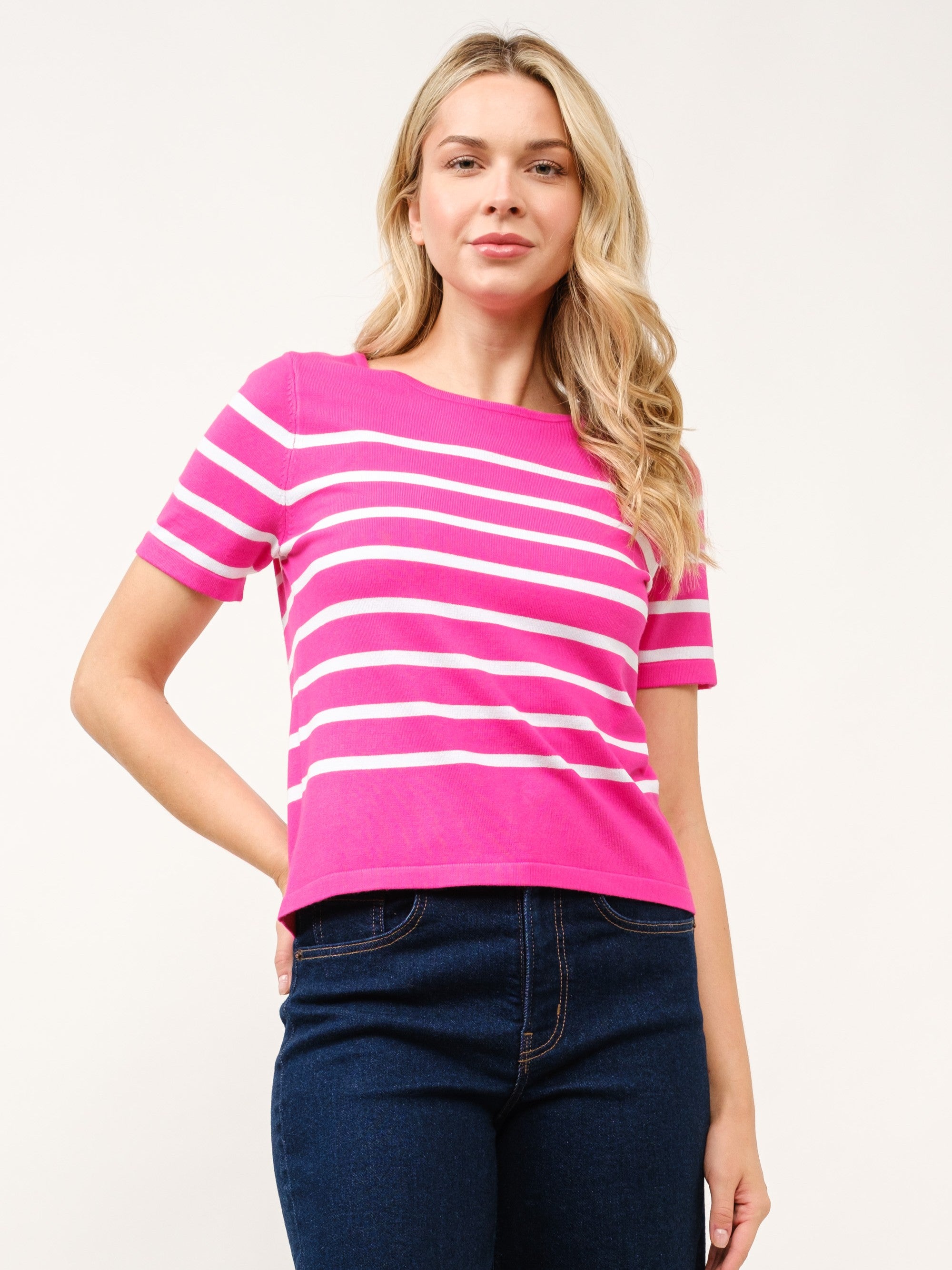 Cielo Striped Short Sleeve Crew Neck Sweater in pink and white stripes by Cielo 1985 Inc., styled with denim jeans