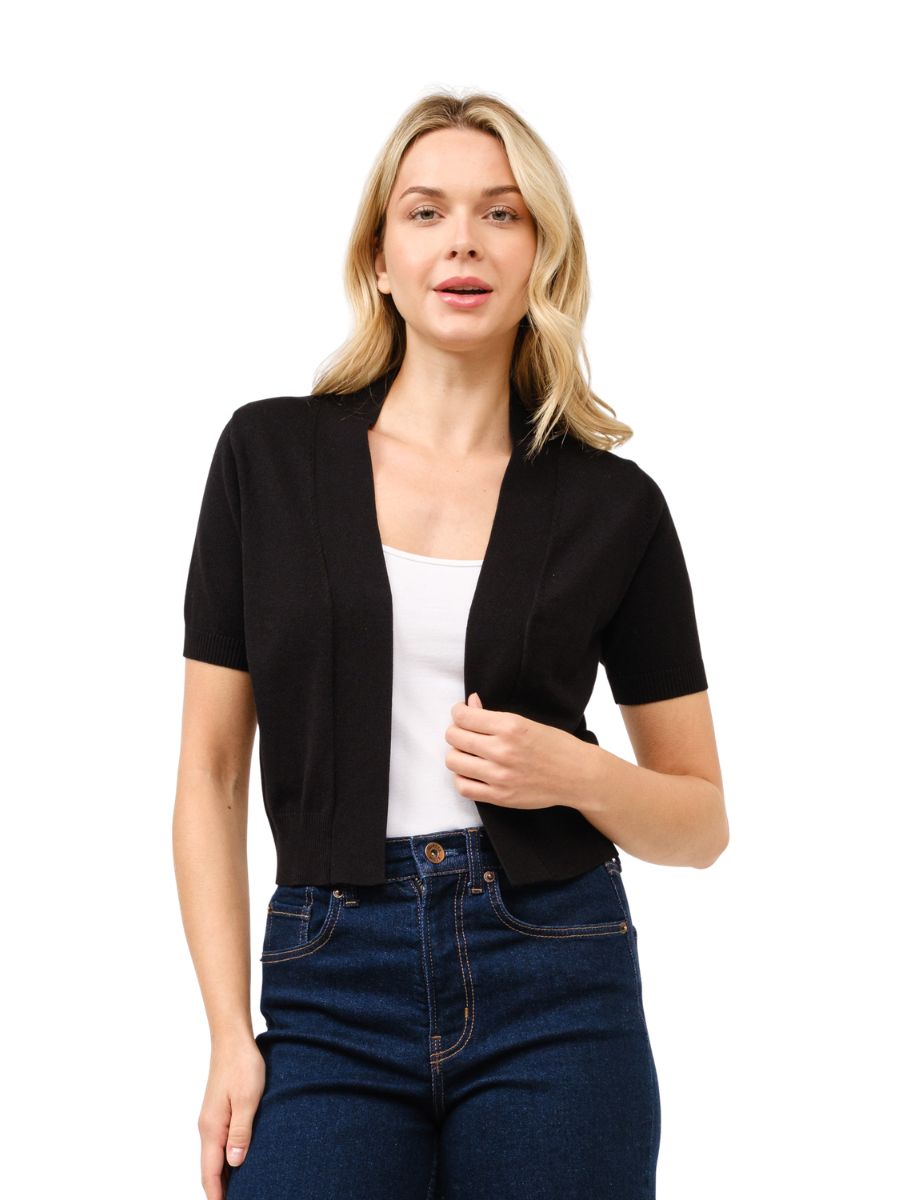 Black Cielo Short Sleeve Open Bolero Cardigan by Cielo 1985 Inc., styled with dark denim jeans and white top.