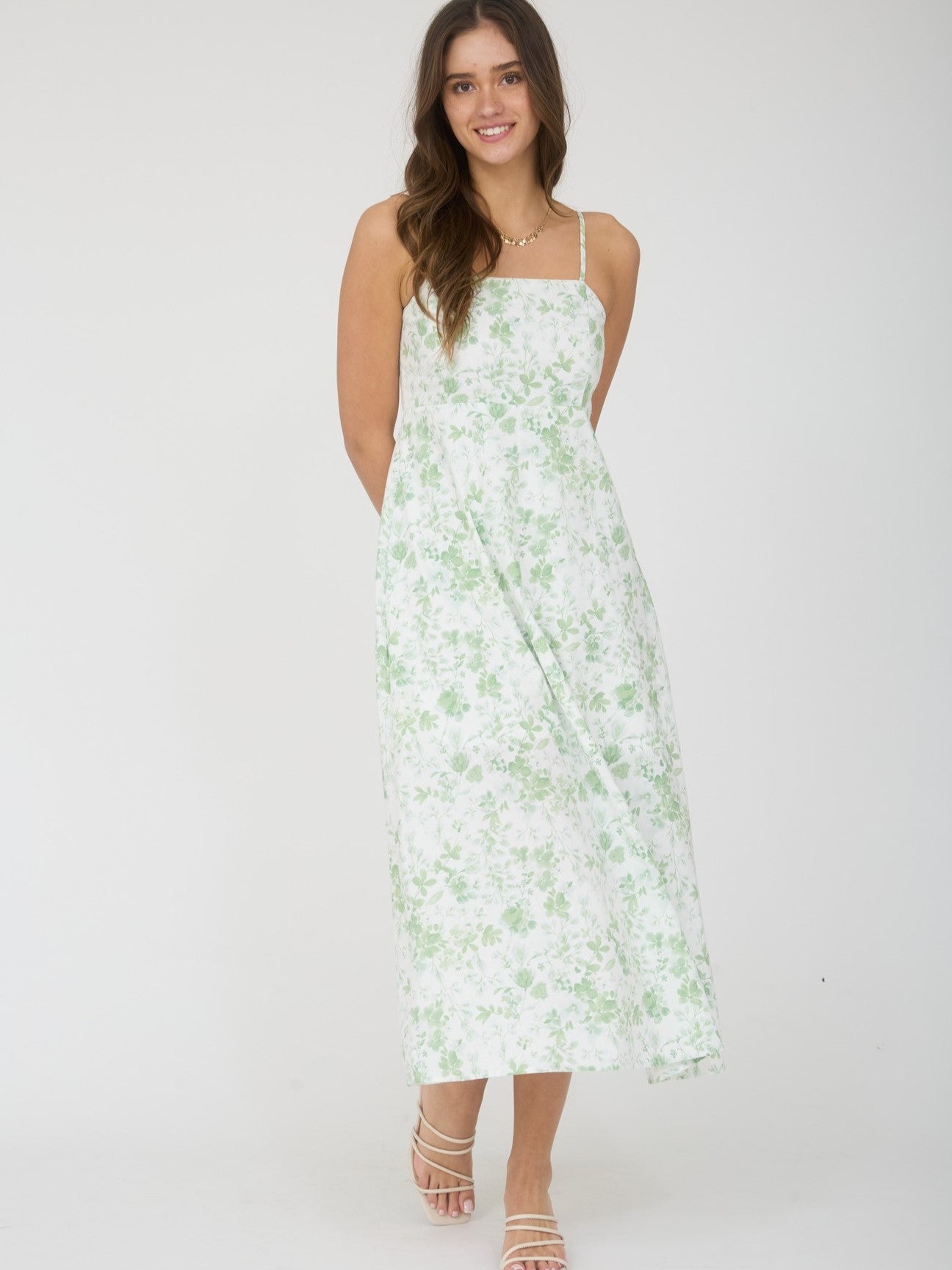 Light green and white Watercolor Floral Spaghetti Strap Midi Dress by Mine with delicate floral print and flowy silhouette