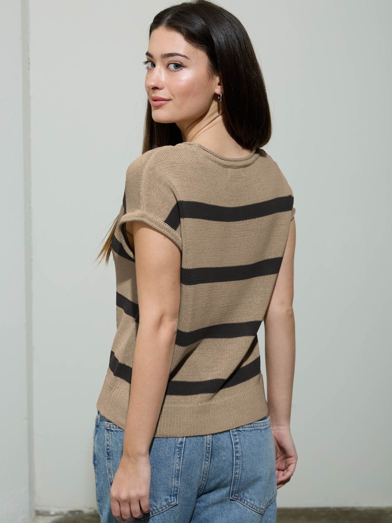 Striped Front Seam Cap Sleeve Crew Top by Mine in khaki with black stripes, paired with casual blue denim jeans.